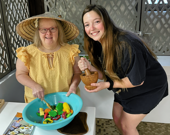 Image of MJ, a Direct Support Professional with pictured with Kyle.